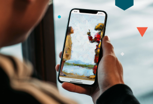 Person looking at robot on mobile phone